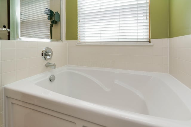 full bath with a bath