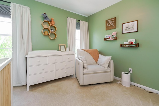 sitting room with light colored carpet