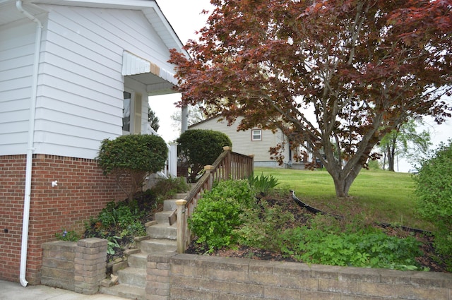 view of home's exterior with brick siding