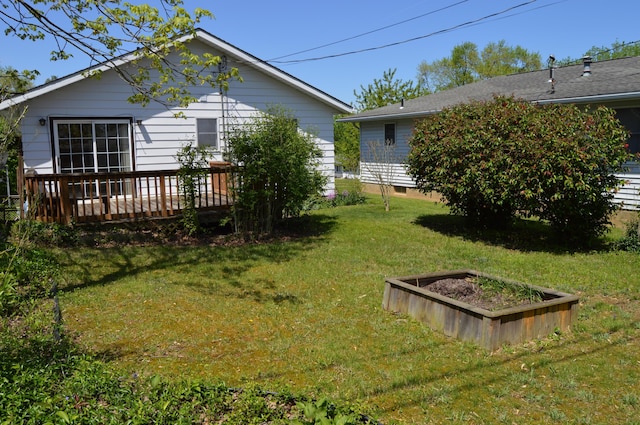 view of yard featuring a wooden deck