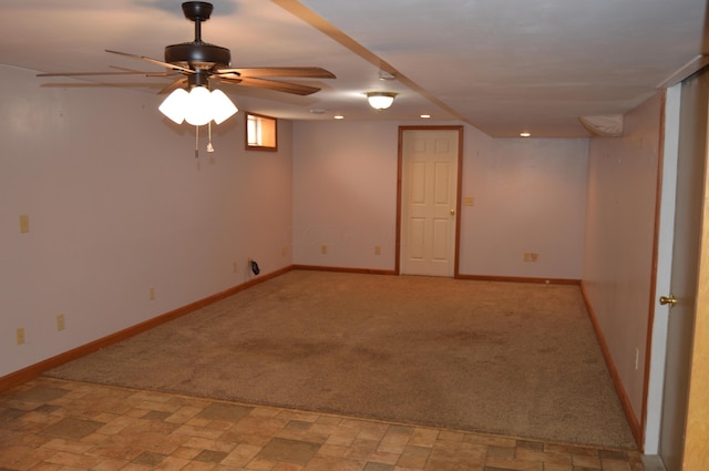 interior space with light carpet, baseboards, stone finish floor, recessed lighting, and a ceiling fan