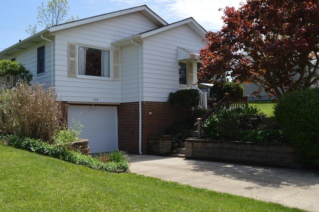 view of front of home with brick siding, a garage, a front lawn, and driveway