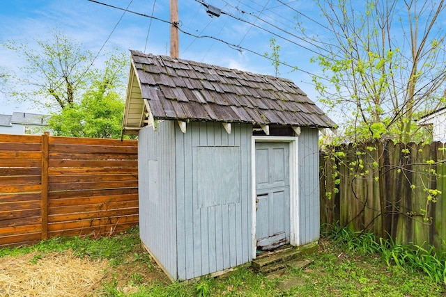 view of shed with a fenced backyard