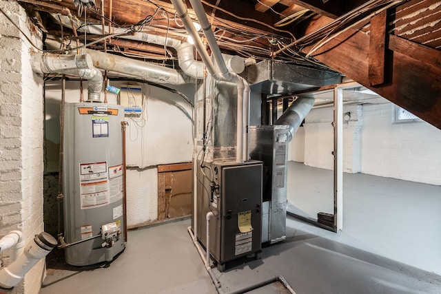 utility room featuring heating unit and gas water heater