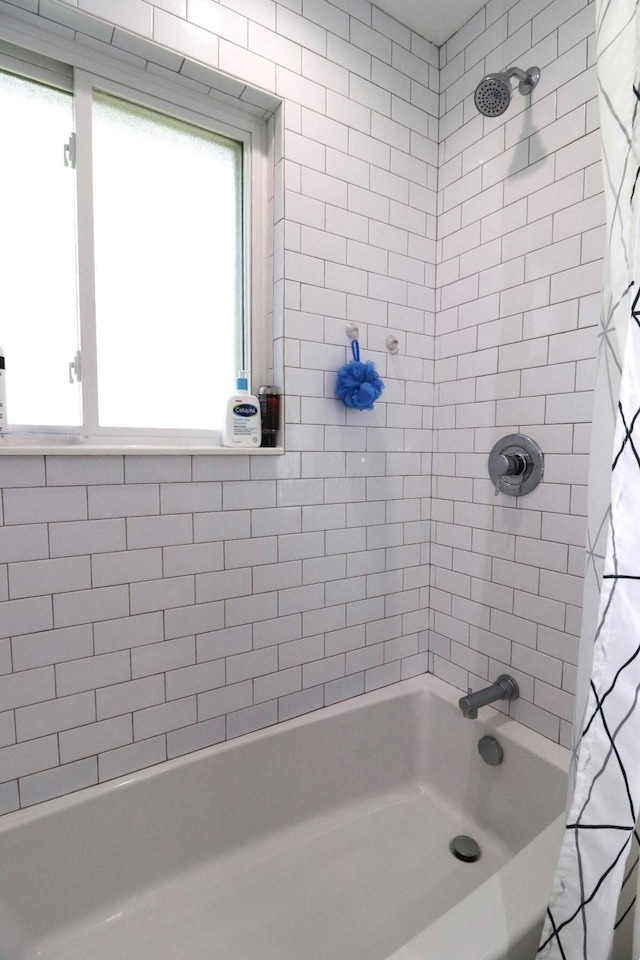 full bath with shower / tub combo with curtain