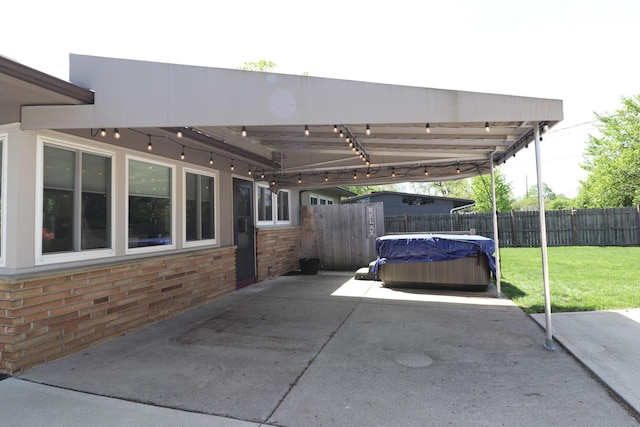 view of patio with fence and an attached carport