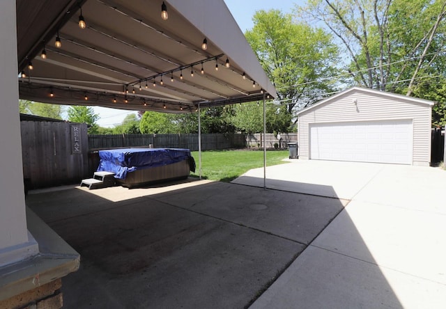 view of car parking featuring a fenced backyard and a detached garage