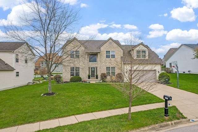 7514 Murdock Ln, Canal Winchester, OH 43110 - traditional home featuring a front yard, driveway, and stone siding