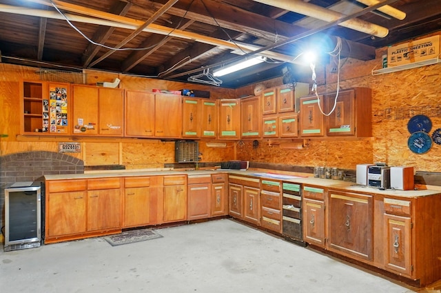 kitchen with brown cabinetry, open shelves, wine cooler, and unfinished concrete floors