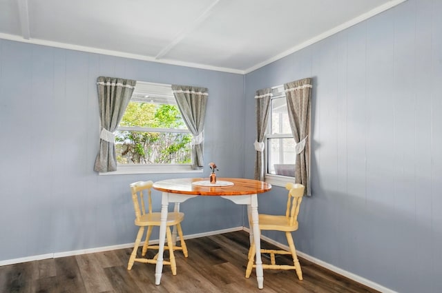 dining area with crown molding, baseboards, plenty of natural light, and wood finished floors