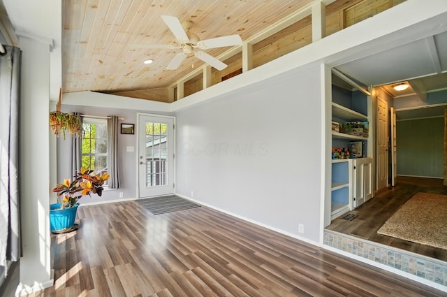 interior space featuring baseboards, wood ceiling, a ceiling fan, and wood finished floors