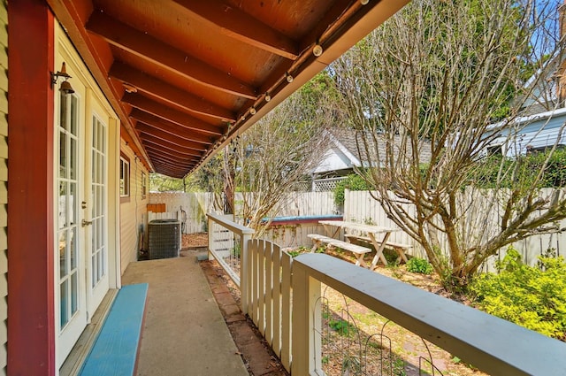 balcony with french doors and central AC