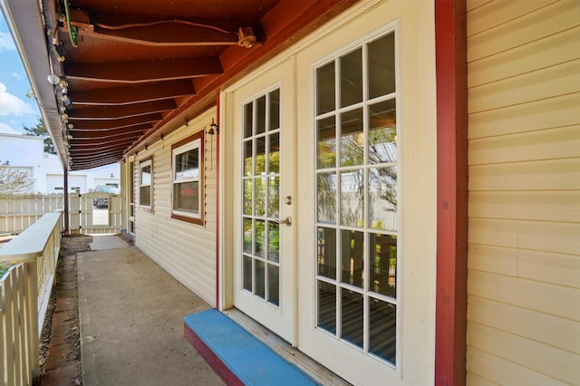 exterior space with fence and french doors