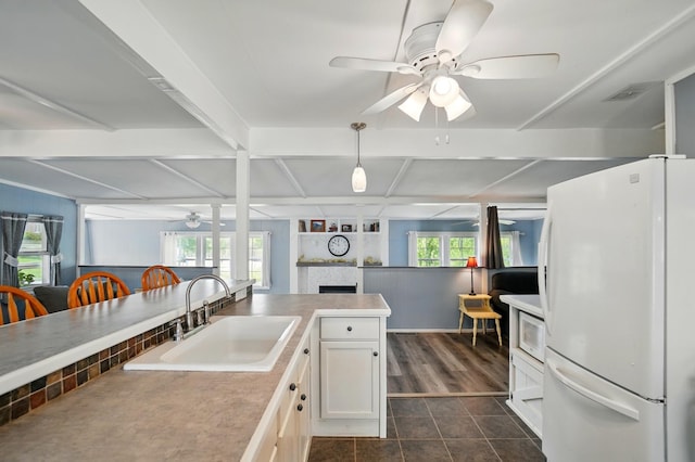 kitchen featuring a sink, white appliances, plenty of natural light, a ceiling fan, and coffered ceiling