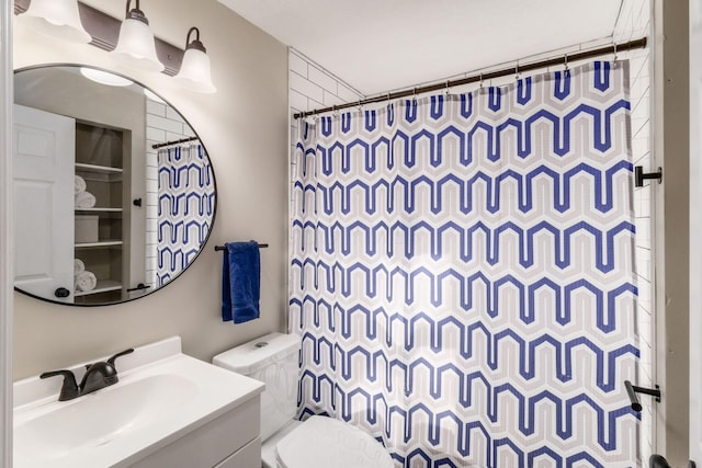 bathroom featuring toilet, curtained shower, and vanity