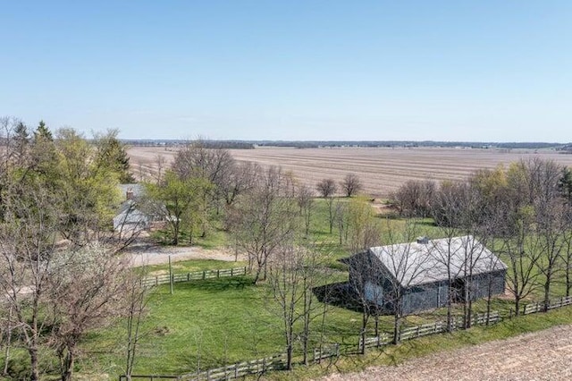 birds eye view of property with a rural view