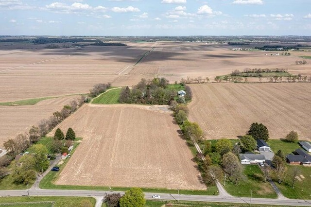 birds eye view of property with a rural view
