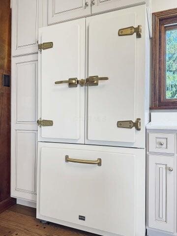 doorway to outside featuring dark wood-style flooring
