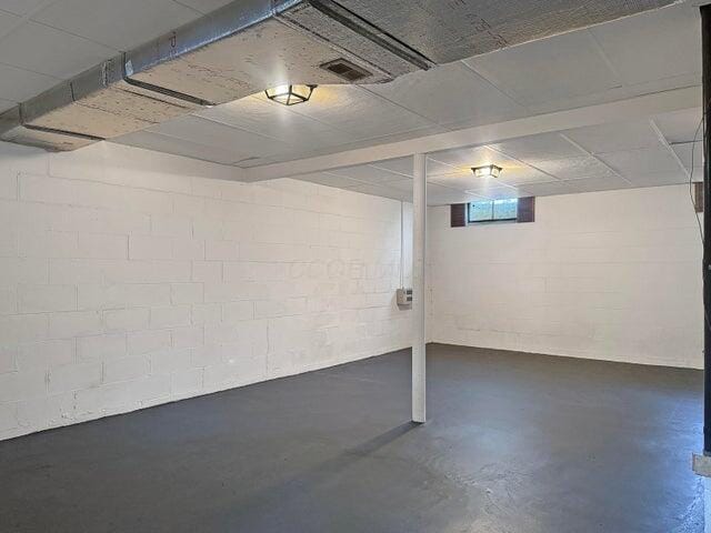 basement with concrete block wall