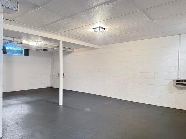basement with concrete block wall