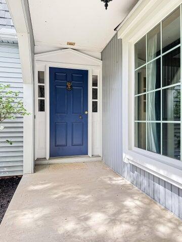 entrance to property with covered porch