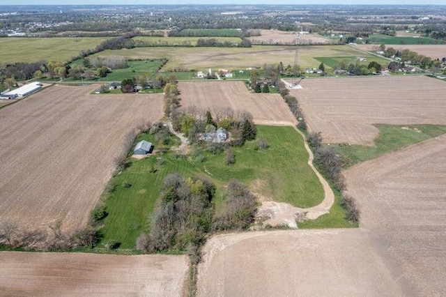 birds eye view of property featuring a rural view