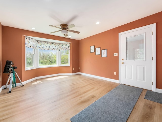 foyer with a ceiling fan, baseboards, recessed lighting, and light wood-type flooring