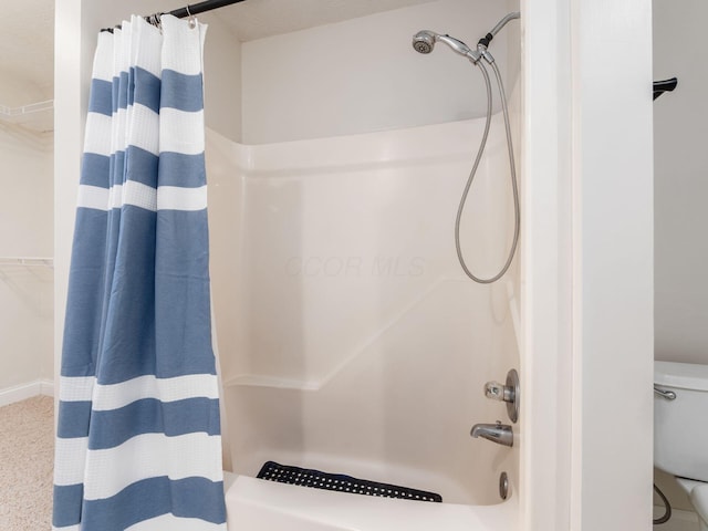 full bath with toilet and shower / bath combo