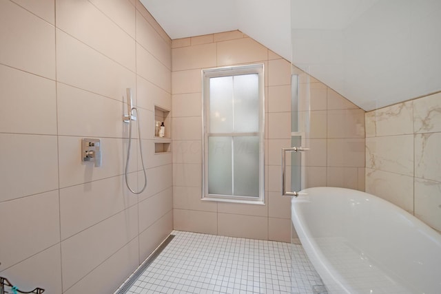 618 Berkeley Rd, Columbus, OH 43205 - bathroom with tile walls, a soaking tub, tile patterned flooring, and a tile shower