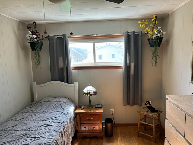 171 N Main St, Johnstown, OH 43031 - bedroom with baseboards, ornamental molding, wood finished floors, and a decorative wall