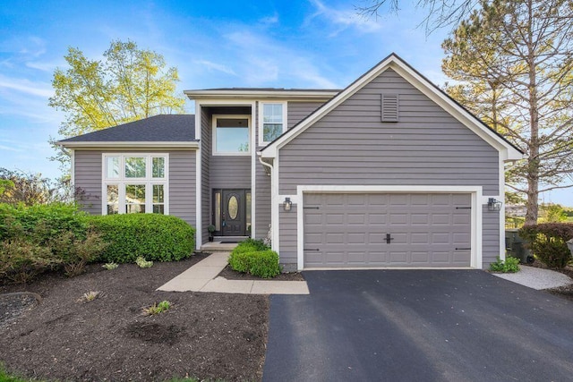 view of front of home featuring driveway and a garage