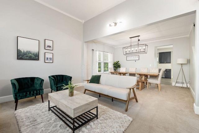 living room featuring crown molding, baseboards, and light colored carpet