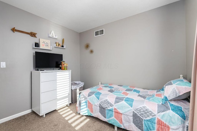 bedroom featuring baseboards, light colored carpet, and visible vents