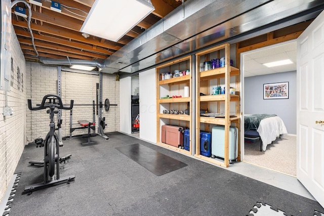exercise room with brick wall