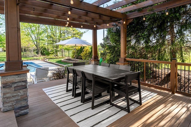 wooden terrace featuring a pergola, an outdoor pool, and outdoor dining space