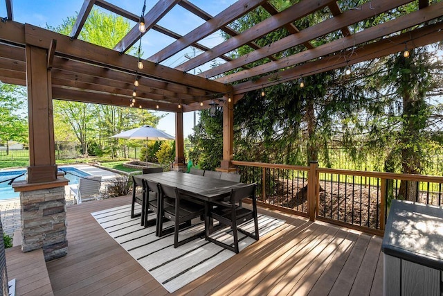 wooden terrace with an outdoor pool, a pergola, and outdoor dining space
