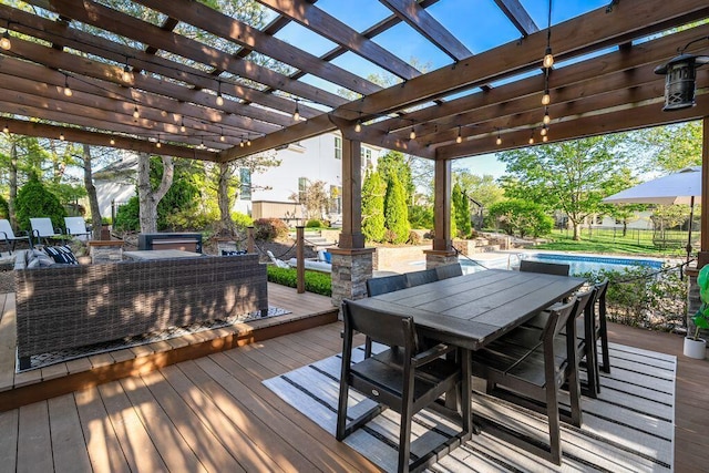 deck with a fenced in pool, outdoor dining space, and a pergola