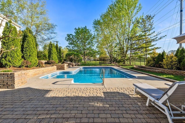 view of pool featuring a patio and a fenced in pool