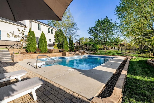 outdoor pool featuring a patio