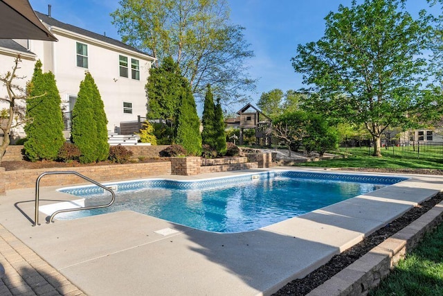 view of swimming pool featuring a fenced in pool, fence, and a patio area