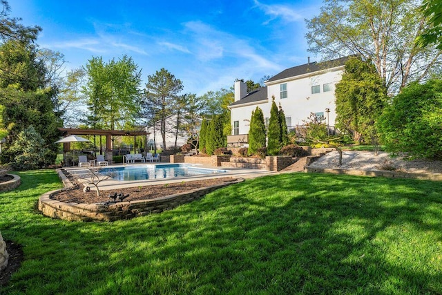 view of yard with a patio and an outdoor pool