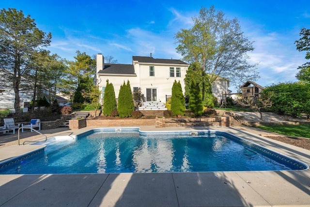 outdoor pool with a patio