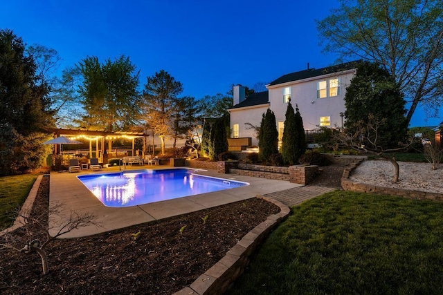 pool with a lawn, an outdoor living space, and a patio area