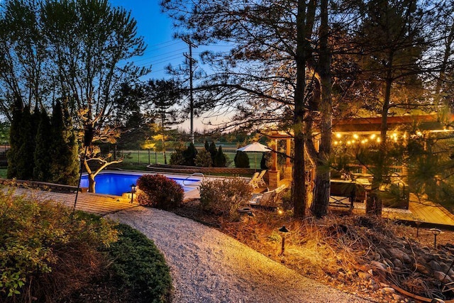 view of swimming pool featuring a fenced in pool and fence