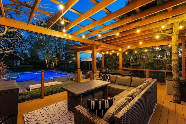 pool with a deck, an outdoor living space, a fenced backyard, and a pergola