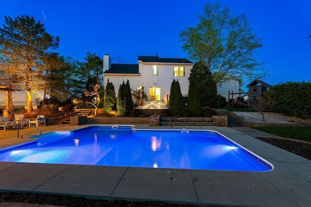outdoor pool featuring a patio