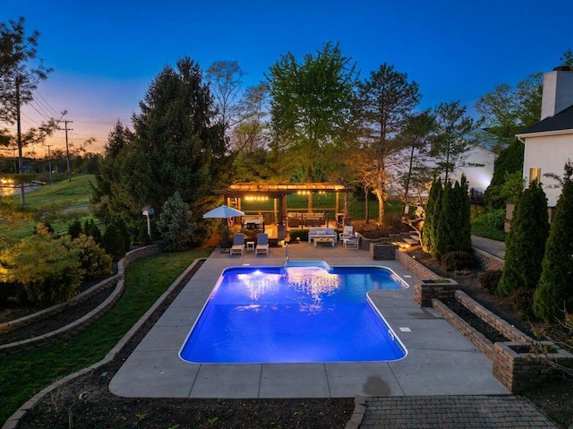 pool with a pergola, outdoor lounge area, and a patio area