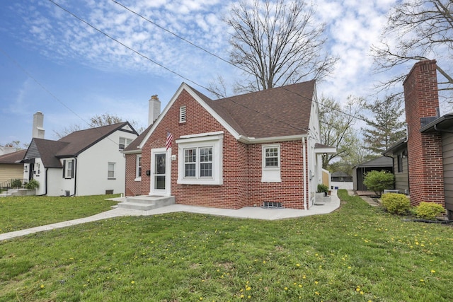 603 S James Rd, Columbus, OH 43213 - view of front of home with brick siding and a front yard