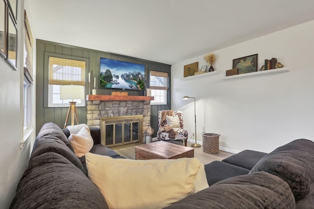 603 S James Rd, Columbus, OH 43213 - living area with baseboards, wood finished floors, and a fireplace