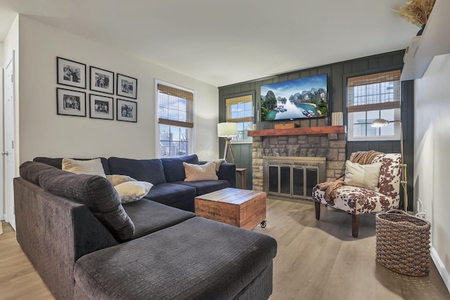 603 S James Rd, Columbus, OH 43213 - living room featuring a stone fireplace and light wood finished floors